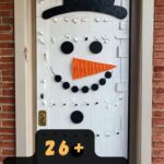 These DIY Snowman Door Decorations Are Too Cute To Skip!