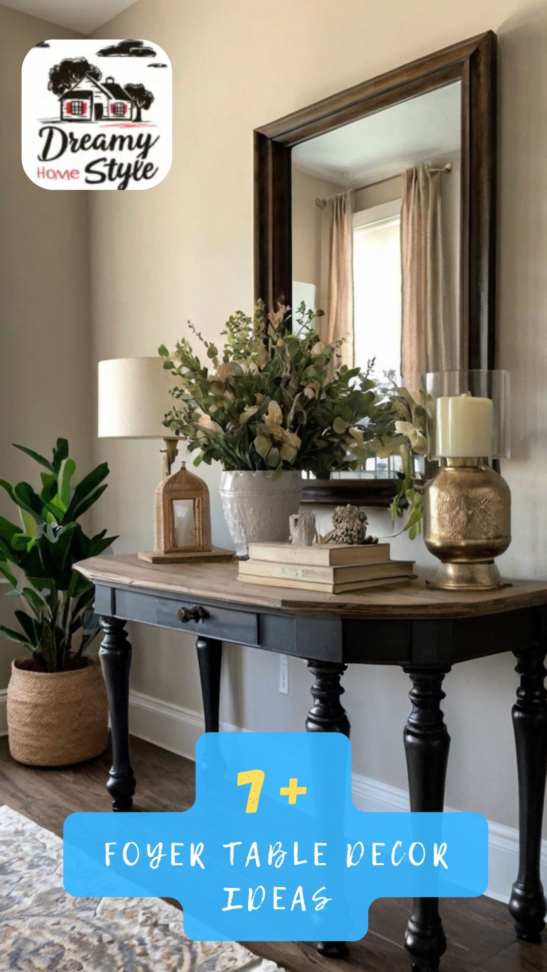 Black console table with wood top styled with greenery arrangement, gold candle holder, lamp, and books in foyer