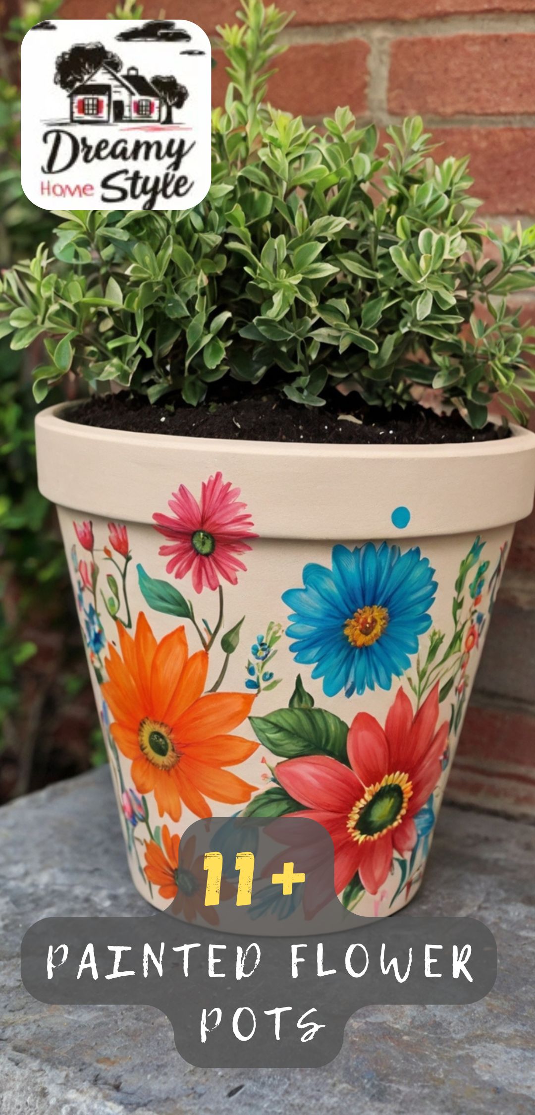 Colorful hand-painted flower pot featuring orange, blue, pink, and red daisy designs with green plant on stone surface