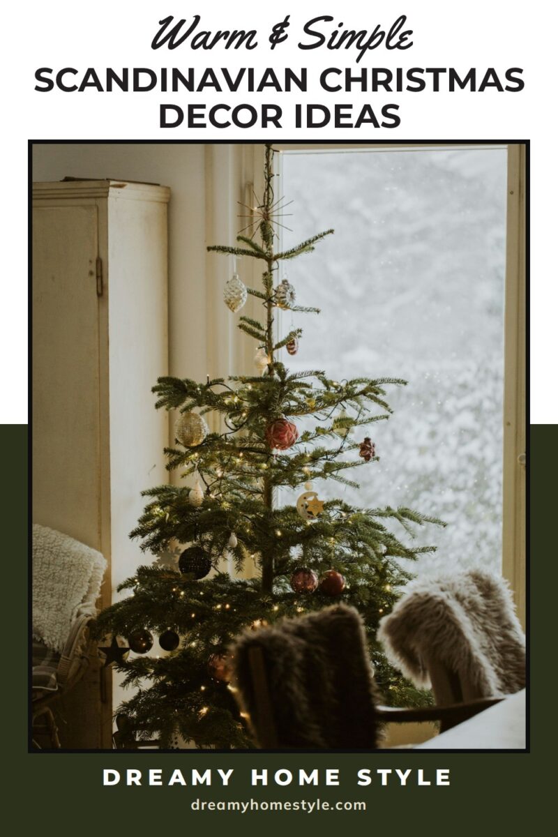 Scandinavian Christmas decor ideas: a sparse Christmas tree with a straw star on top by a snowy window, a wooden sled under it and sheepskins on two chairs