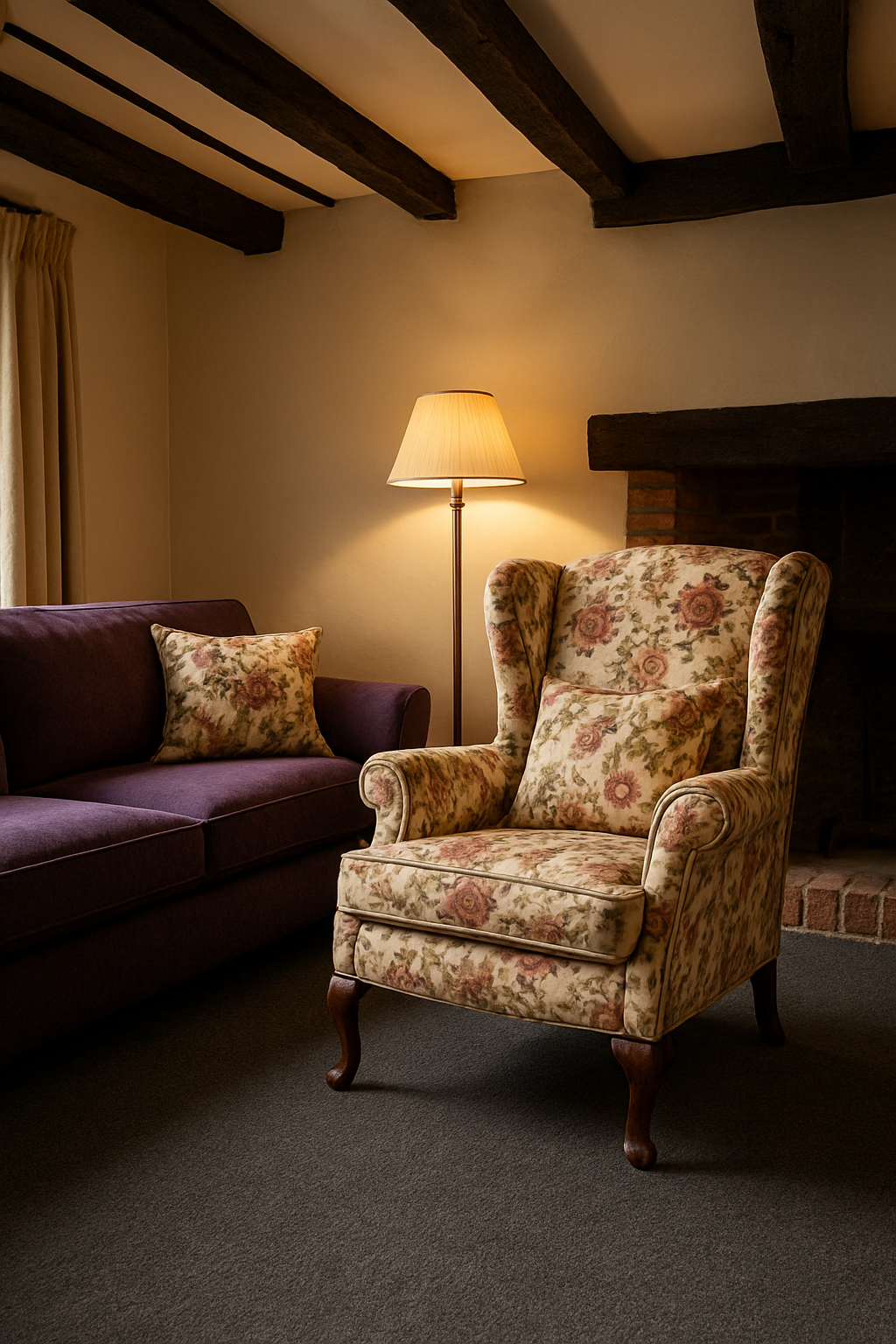 Purple sofa in cottage family room beside gray wall-to-wall carpet and floral chair